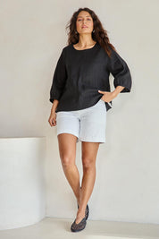 Model Tahneei wearing size 10 of the Linen 3/4 Sleeve Top – Black in colour Black, from the front