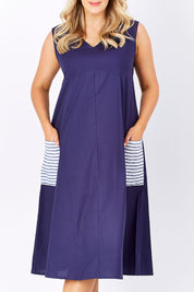 Model Jess wearing size 14 of the Natural Ain colourline Dress - Blueberry (Blue), from the front, cropped image