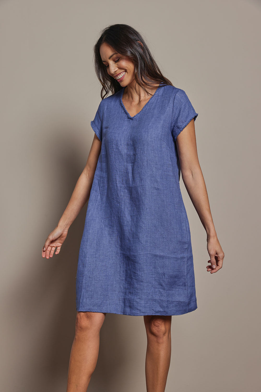Model Amanda wearing size 10 of the Linen V Neck Shift Dress in colour Denim (Blue), from the front, cropped image