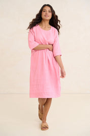 Model Tahnee wearing size 10 of the Linen Pocket Dress in colour Blush (Pink), from the front, showing the whole outfit
