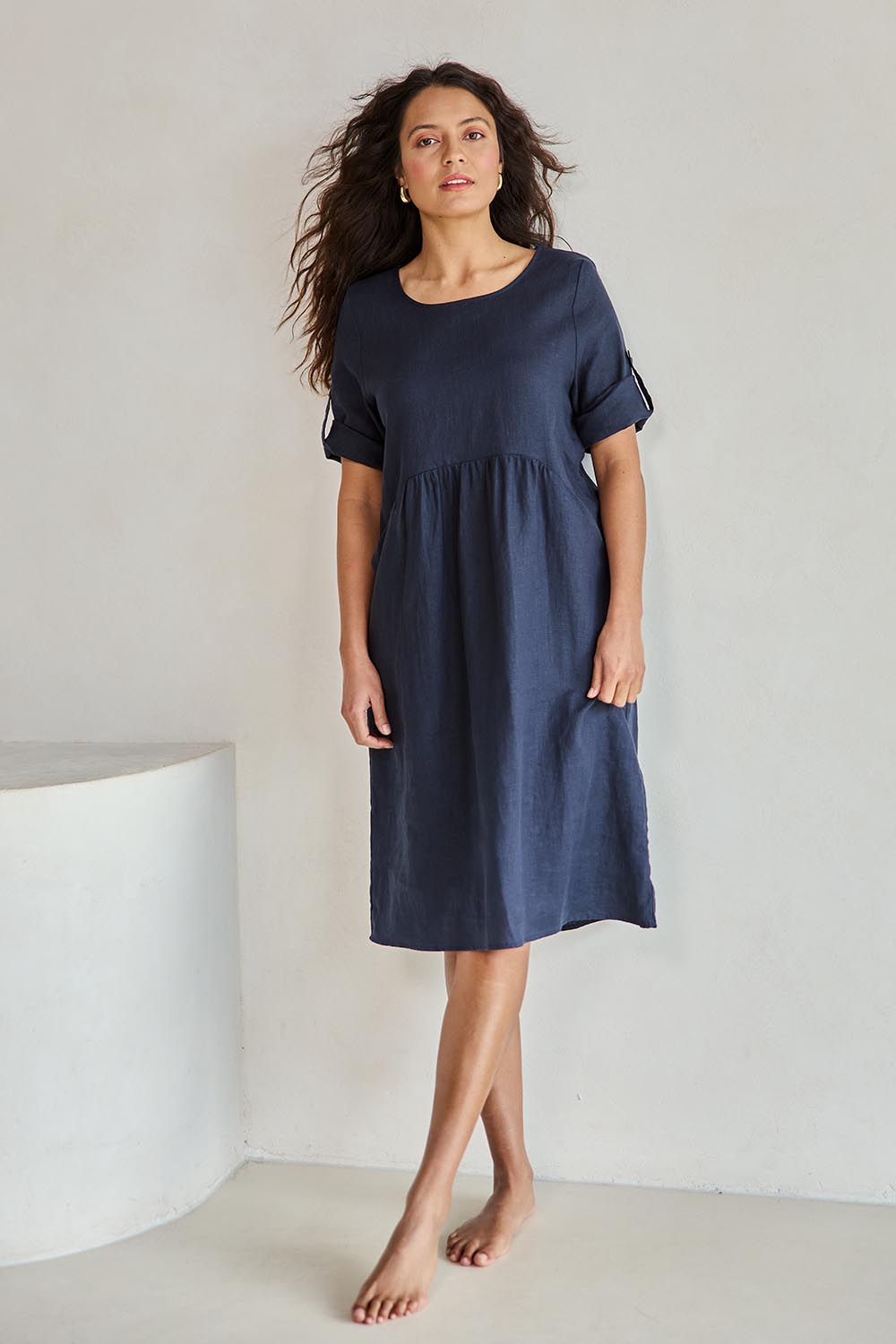 Model Tahneei wearing size 10 of the Linen Pocket Dress – Navy in colour Navy, from the front