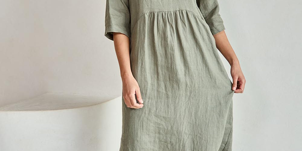 Model Tahneei wearing size 10 of the Linen Pocket Dress – Olive in colour Olive, from the front
