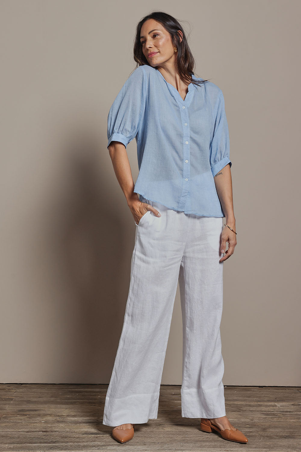 Model Amanda wearing size 10 of the Cotton Button Down Blouse in colour Blue (Blue), from the front, showing the whole outfit