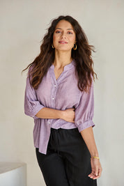 Model Tahneei wearing size 10 of the Cotton Button Down Blouse – Grape in colour Grape, in a cropped view