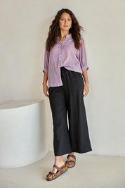 Model Tahneei wearing size 10 of the Cotton Button Down Blouse – Grape in colour Grape, from the front