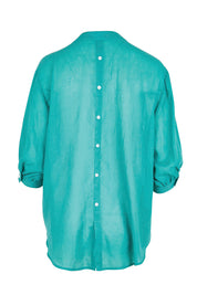 Product shot of the Cotton Button Down Blouse – Lagoon in colour Lagoon, from the back