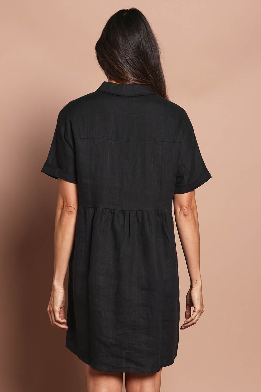 Model Amanda wearing size 10 of the Linen Throw On Dress in colour Black (Black), from the back
