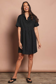 Model Amanda wearing size 10 of the Linen Throw On Dress in colour Black (Black), from the front, showing the whole outfit
