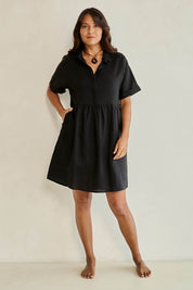 Model Tahnee wearing size 10 of the Linen Throw On Dress in colour Black (Black), from the front, showing the whole outfit