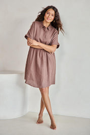 Model Tahneei wearing size 10 of the Linen Throw On Dress – Coffee in colour Coffee, from the front