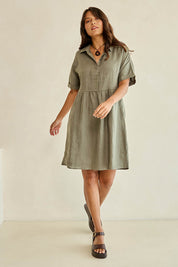 Model Tahnee wearing size 10 of the Linen Throw On Dress in colour Olive (Green), from the front, showing the whole outfit