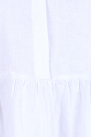 Product shot of the Linen Throw On Dress – White in colour White, showing detail