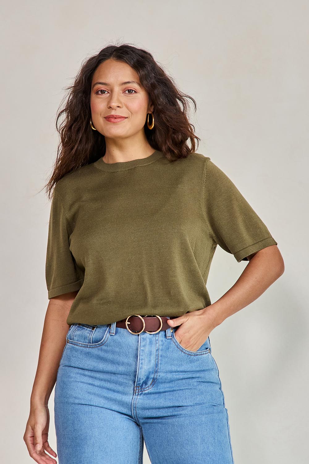 Model Tahneei wearing size 10 of the Linen Lyocell Textured Knit Tee – Green in colour Green, in a cropped view