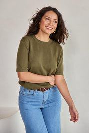 Model Tahneei wearing size 10 of the Linen Lyocell Textured Knit Tee – Green in colour Green, in a cropped view