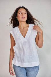 Model Tahneei wearing size 10 of the Linen V Neck Tank – White in colour White, in a cropped view