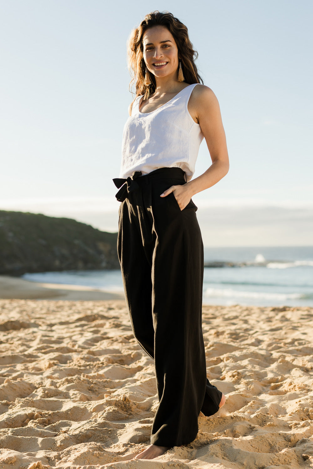 Model Ilona wearing size 10 of the Tailored Linen Blend Wide Leg Pant in colour Midnight (Black), from the front, showing the whole outfit