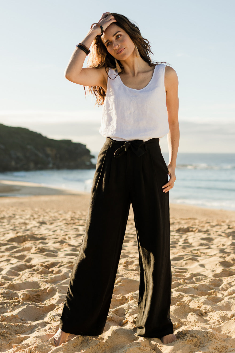Model Ilona wearing size 10 of the Tailored Linen Blend Wide Leg Pant in colour Midnight (Black), from the front, showing the whole outfit