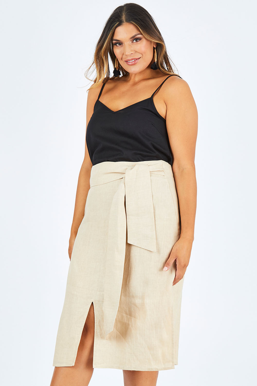 Model Palatina wearing size 14 of the Cotton Linen Waist Tie Skirt in colour Macadamia, from the front, cropped image