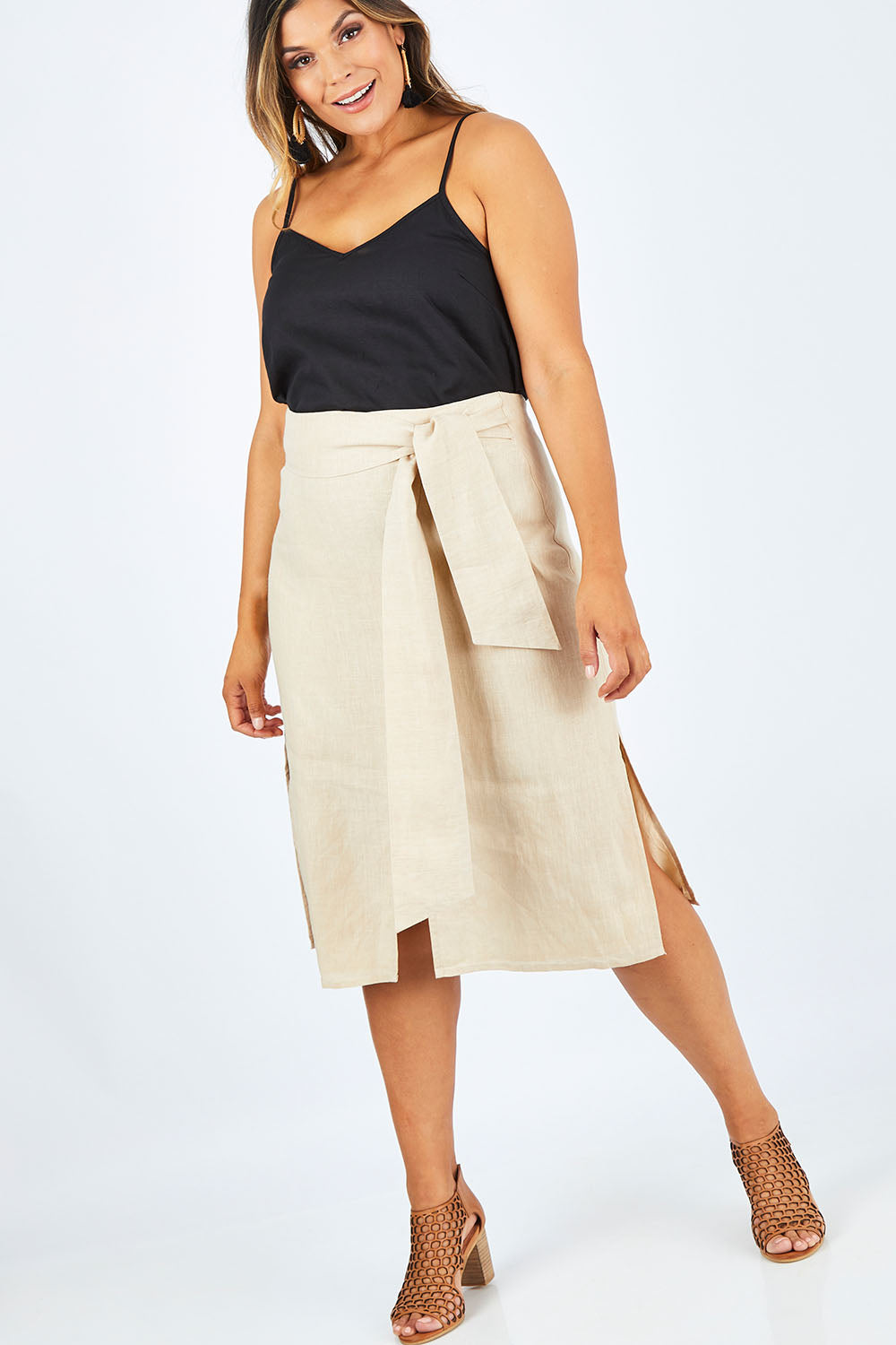 Model Palatina wearing size 14 of the Cotton Linen Waist Tie Skirt in colour Macadamia, from the front, showing the whole outfit
