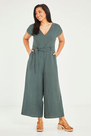 Model Terri-Leigh wearing size 14 of the Linen Blend Jumpsuit in colour Green (Green), from the front, showing the whole outfit