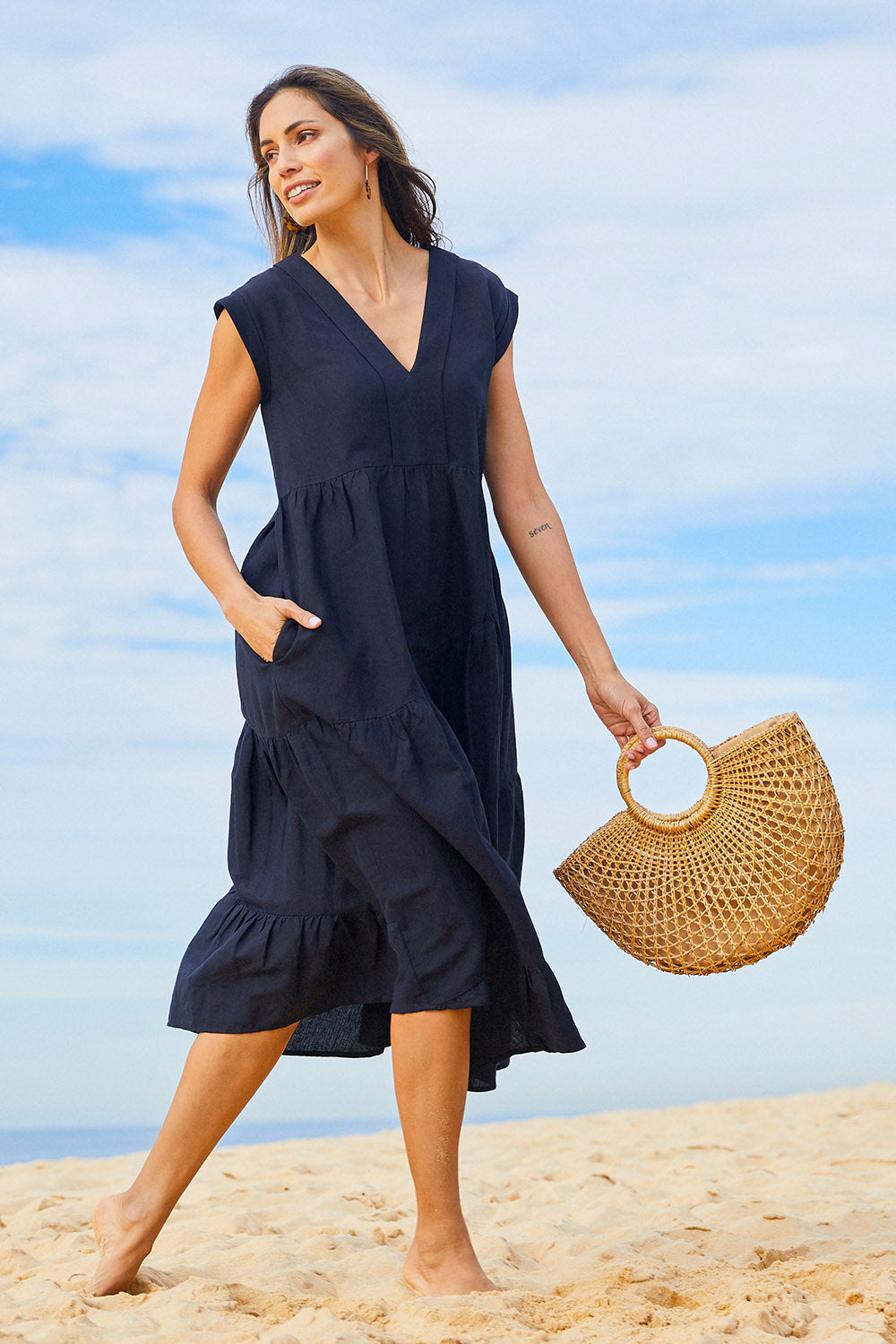 Model Amanda wearing size 10 of the Cotton Linen Tier Dress in colour Midnight (Black), from the front, showing the whole outfit