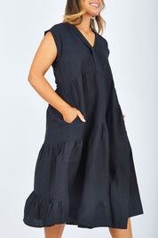 Model Palatina wearing size 14 of the Cotton Linen Tier Dress in colour Midnight (Black), from the front, cropped image
