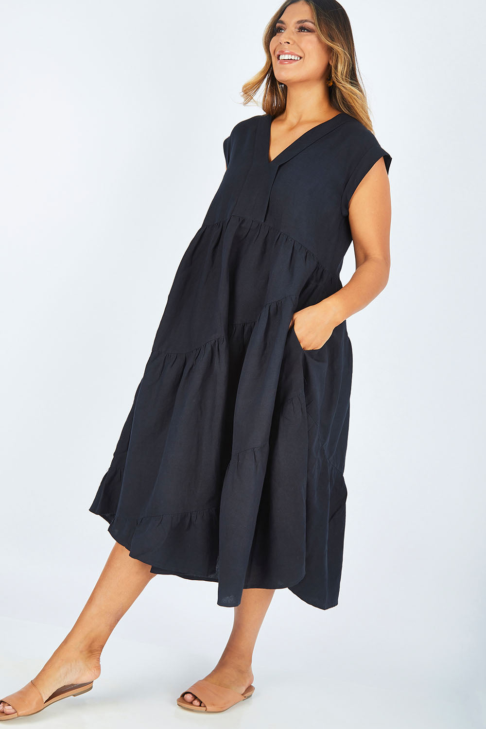 Model Palatina wearing size 14 of the Cotton Linen Tier Dress in colour Midnight (Black), from the front, showing the whole outfit