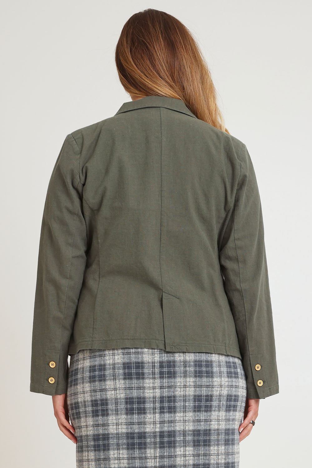 Model Chanel wearing size 16 of the Cotton Linen Blazer in colour Khaki (Green), from the back