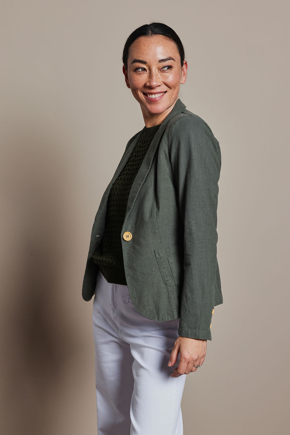 Model Katie wearing size 8 of the Cotton Linen Blazer in colour Khaki (Green), from the front, cropped image