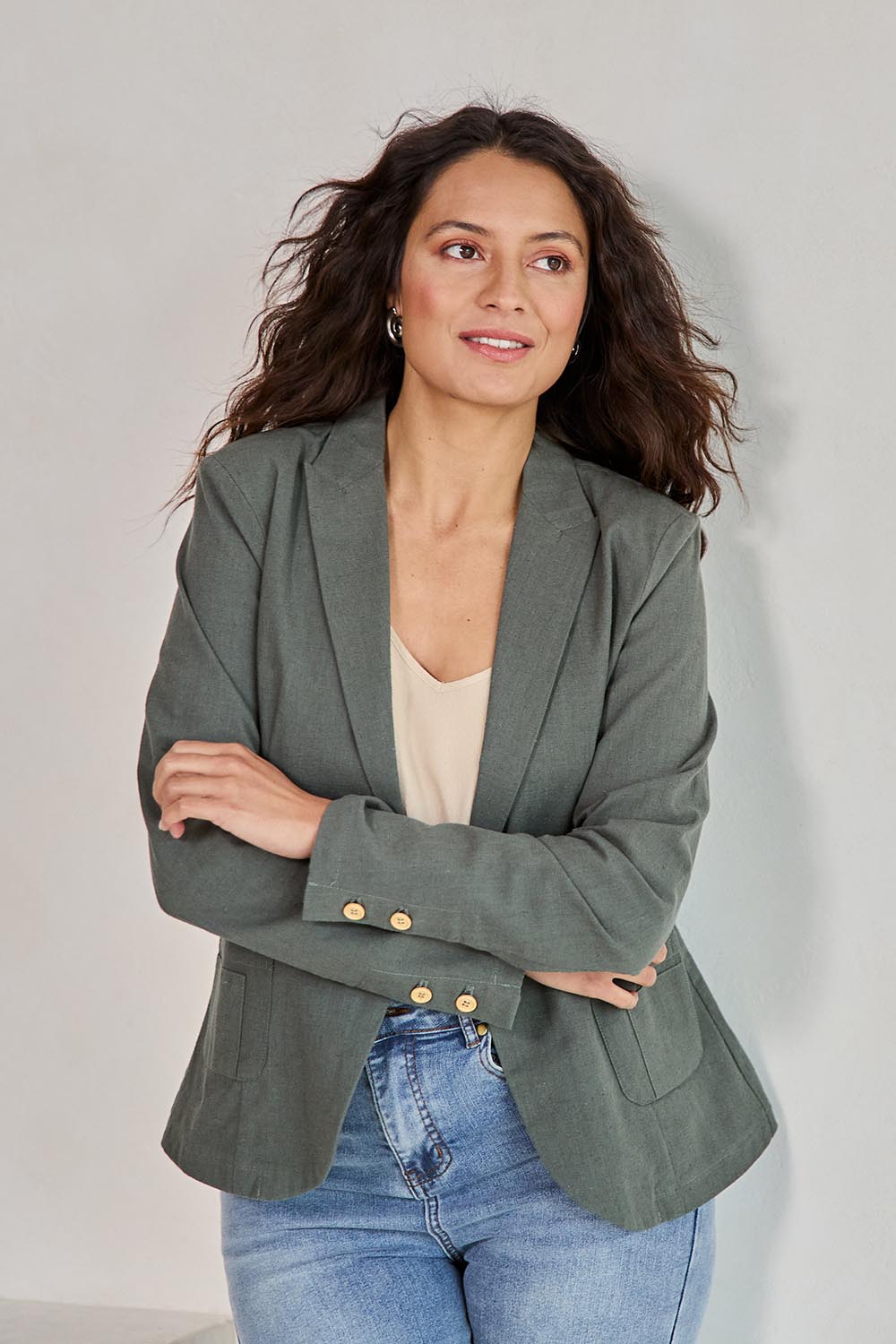 Model Tahneei wearing size 10 of the Cotton Linen Blazer - Khaki in colour Khaki, from an angle
