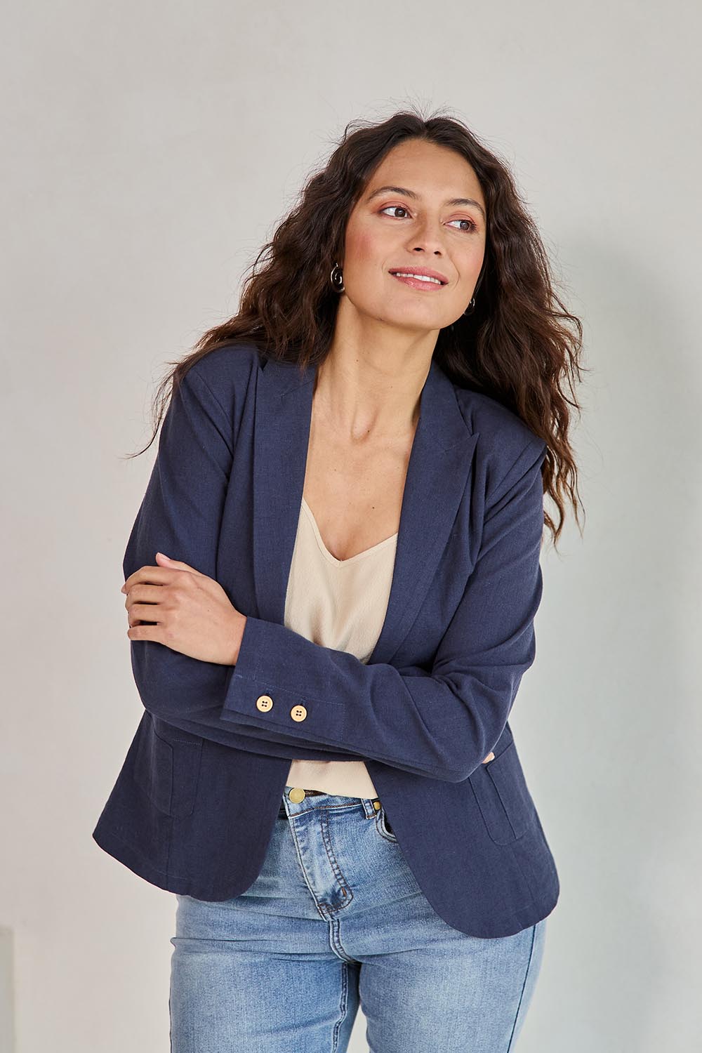 Model Tahneei wearing size 10 of the Cotton Linen Blazer - Navy in colour Navy, from an angle