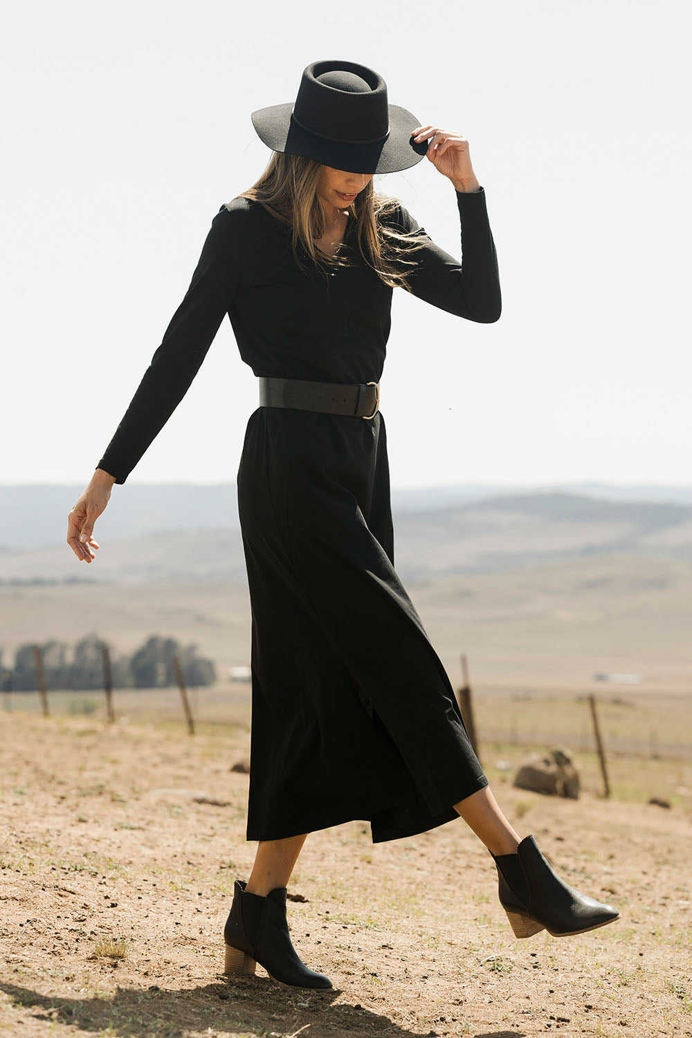 Model Amanda wearing size 10 of the Cotton Stretch Maxi Dress in colour Moonless (Black), from the front, showing the whole outfit