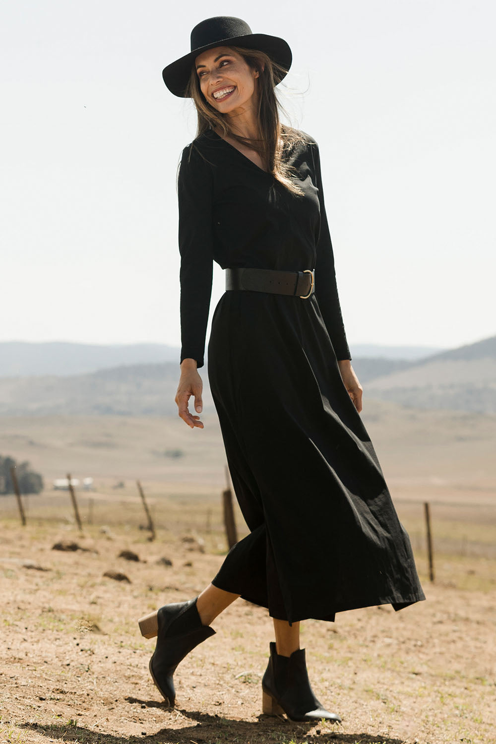 Model Amanda wearing size 10 of the Cotton Stretch Maxi Dress in colour Moonless (Black), from the front, showing the whole outfit