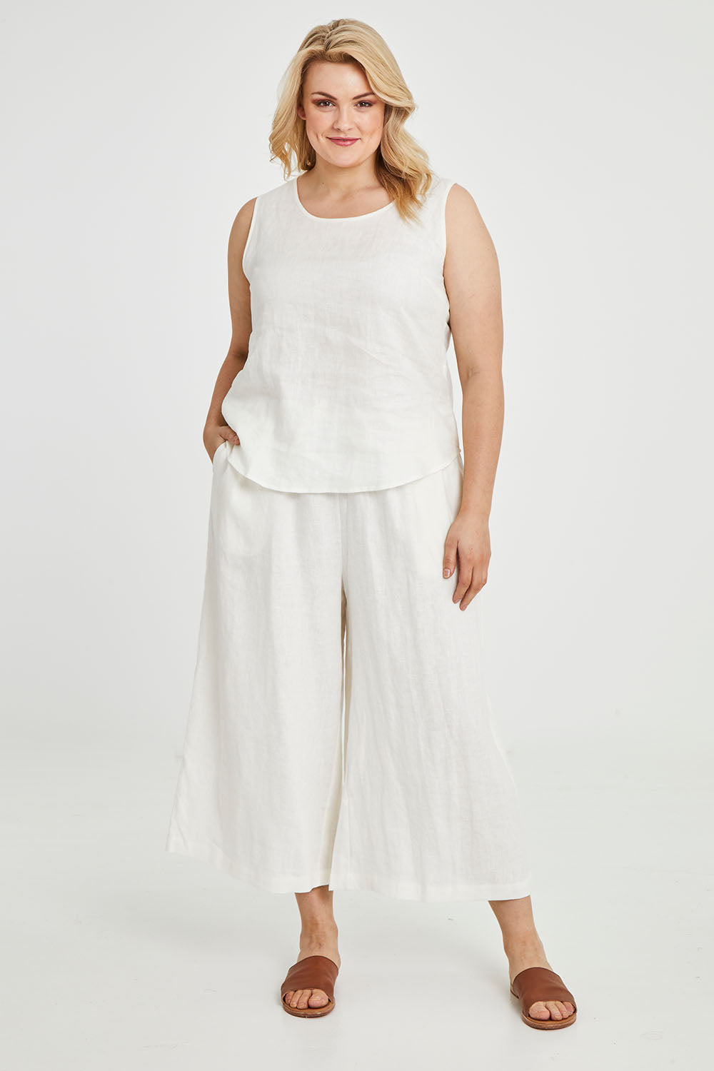 Model Keeara wearing size 16 of the Linen Drawstring Pants in colour White (White), from the front, showing the whole outfit
