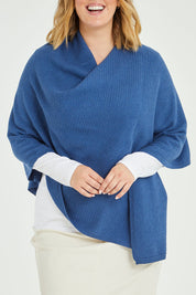 Model Jess wearing size L of the Cotton Cashmere Wool Poncho in colour Blue (Blue), from the front, cropped image