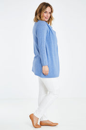 Model Jess wearing size L of the Wool Cashmere Crossover Tunic in colour Bluemarl (Blue), from the front, showing the whole outfit