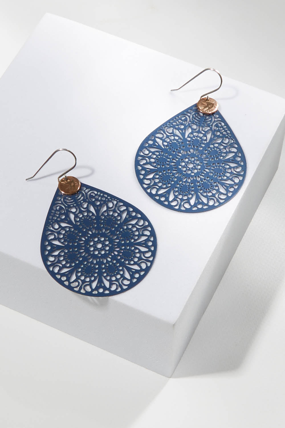 A model wearing size OneSize of the Filigree Earring in colour Denim (Blue), from the front, showing the whole outfit