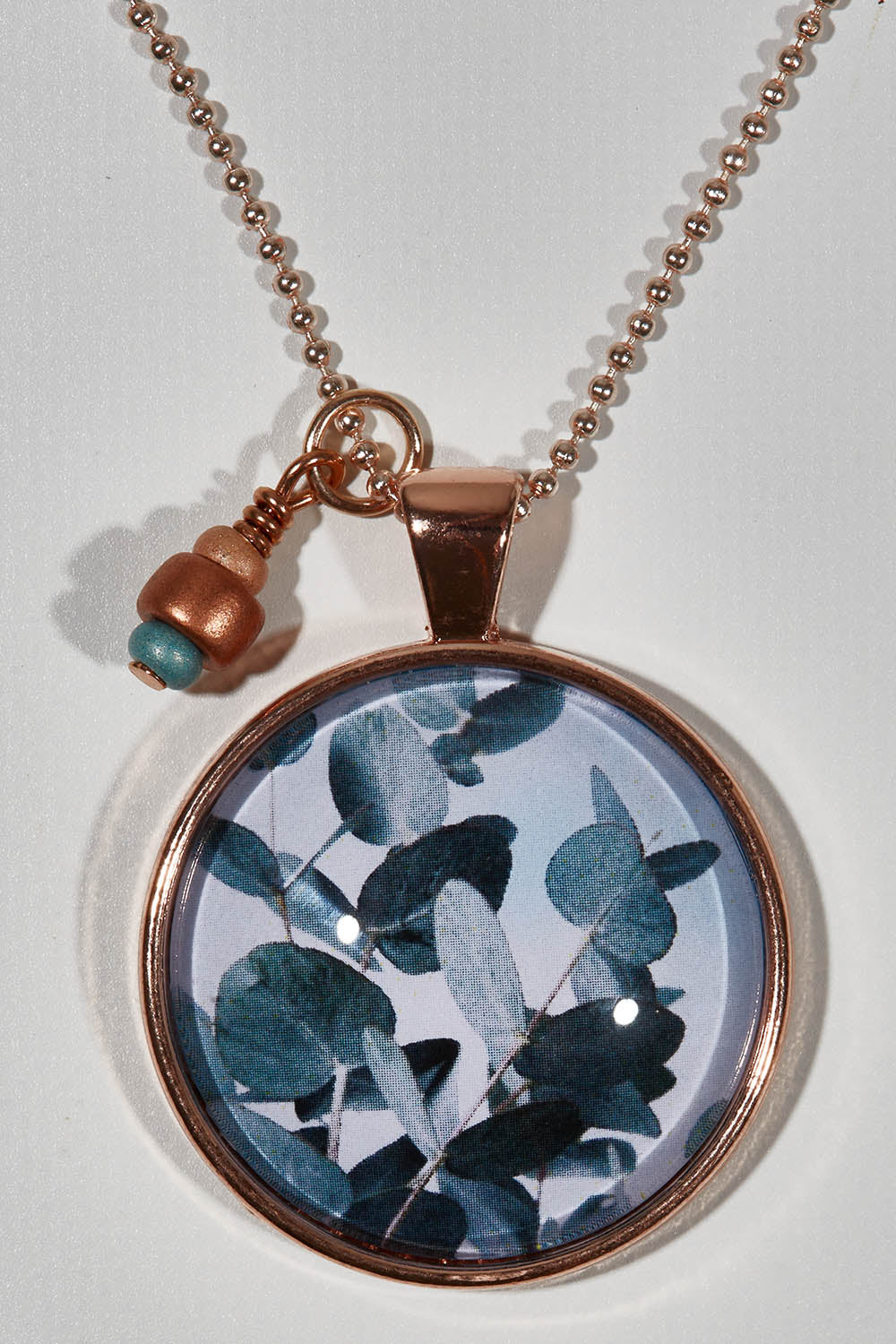 A model wearing size OneSize of the Eucalyptus Pendant With Seed Beads Necklace in colour Eucal (Green), from the front, showing the whole outfit