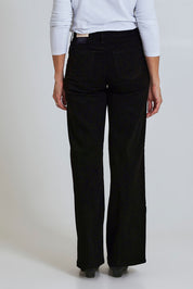 Model Sandy wearing the Teresa Wide Leg Jean in colour Blkrinse (Black), from the back
