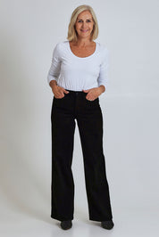 Model Sandy wearing the Teresa Wide Leg Jean in colour Blkrinse (Black), from the front, showing the whole outfit