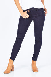 Model Gemma wearing the Ami Skinny in colour Rinse (Blue), from the front, cropped image