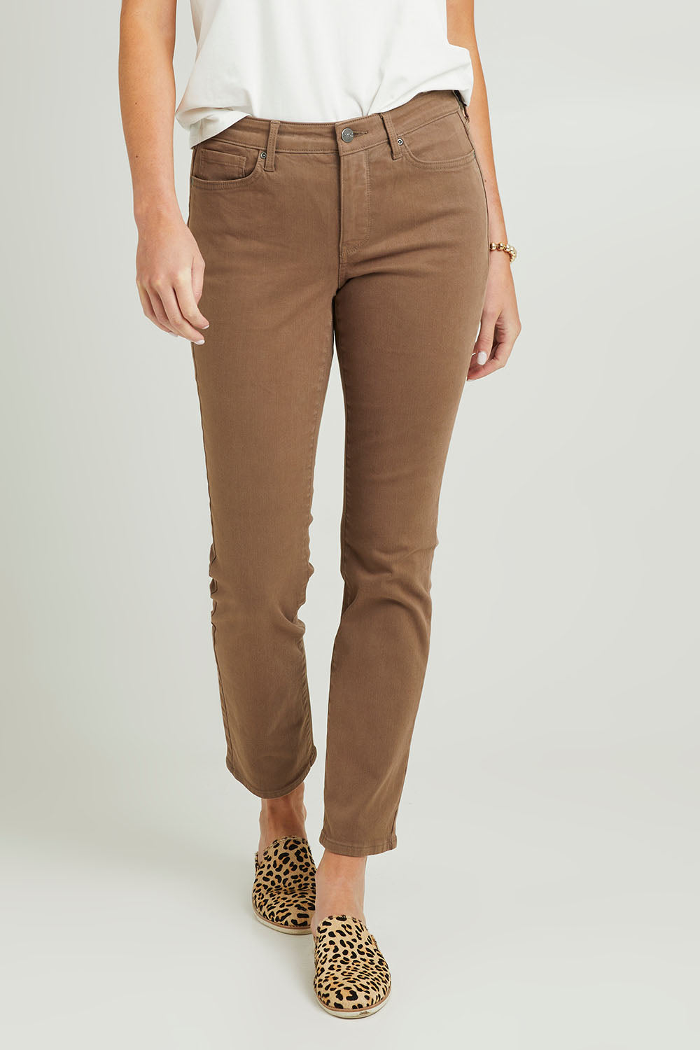 Model Grace wearing the Sheri Slim Jean in colour Incense, from the front, cropped image