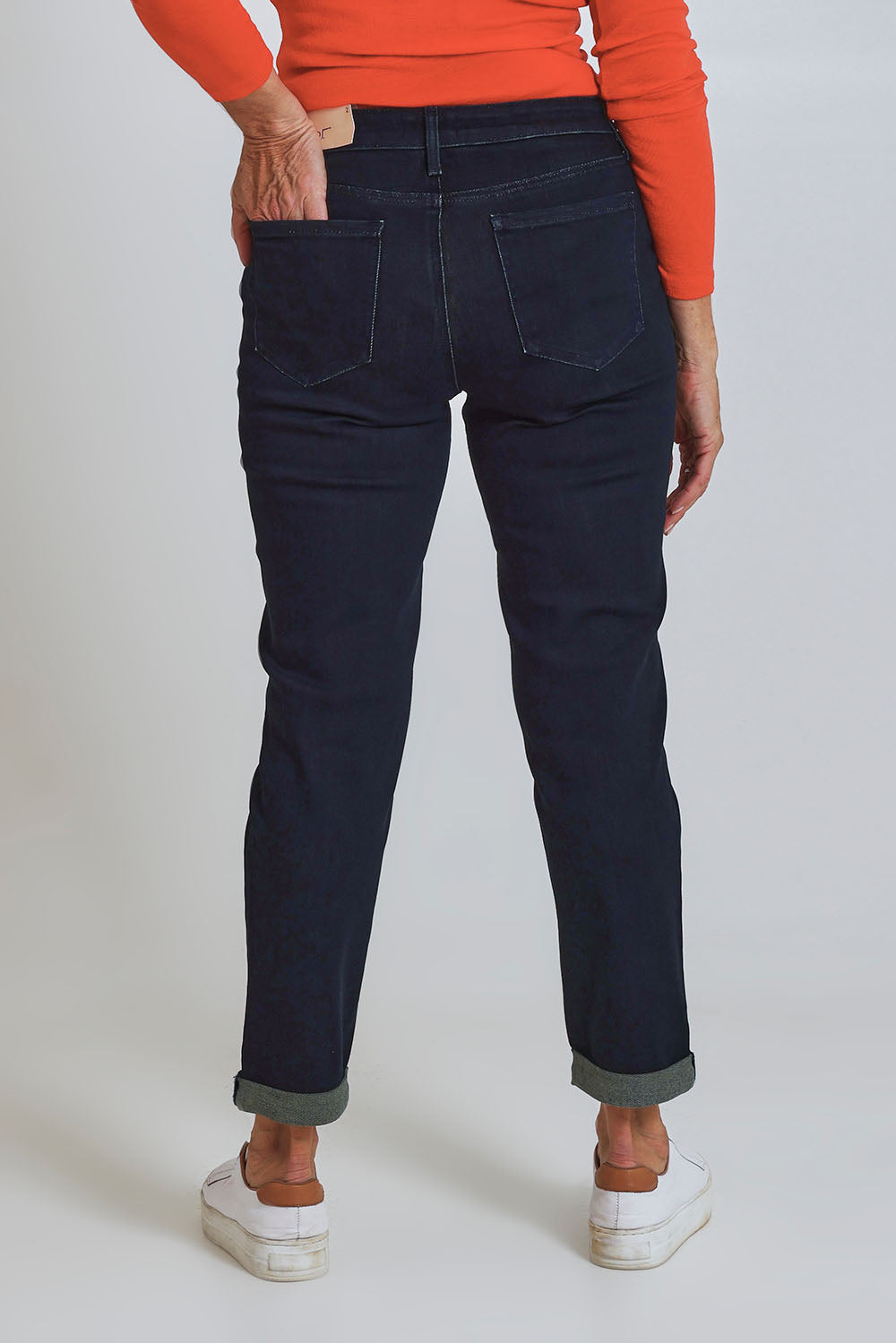 Model Sandy wearing the Margot Girlfriend Jean in colour Midnight (Blue), from the back