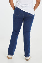 Model Noli wearing the Barbara Bootcut Jean in colour Quinn (Blue), from the back