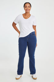 Model Noli wearing the Barbara Bootcut Jean in colour Quinn (Blue), from the front, showing the whole outfit