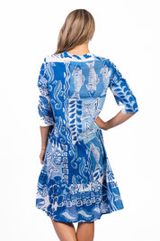 Model Genericm wearing size sample of the Beth Tiered Cotton Dress - Monosea in colour Monosea, from the back