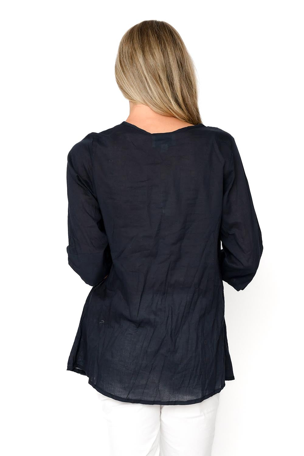 A model wearing the Evie 3/4 Sleeve Pleated Cotton Top in colour Navy (Blue), from the back