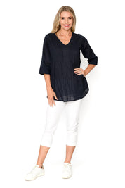 A model wearing the Evie 3/4 Sleeve Pleated Cotton Top in colour Navy (Blue), from the front, showing the whole outfit
