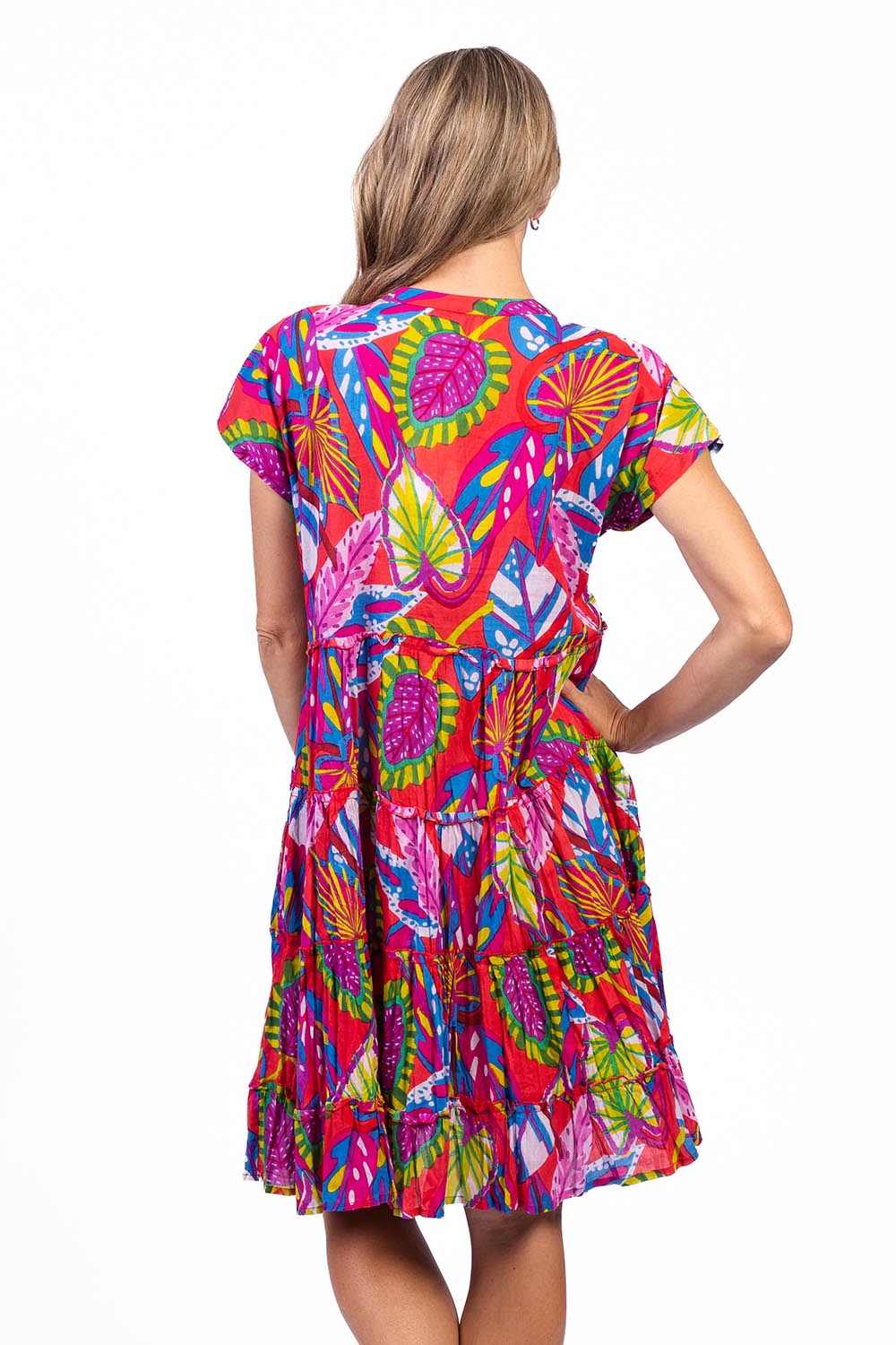 Model Genericm wearing size sample of the Leela Cotton Dress - Coral in colour Coral, from the back