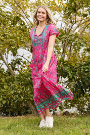 Model Genericm wearing size sample of the Zola Cotton Maxi Dress - Fuchsia in colour Fuchsia, from the front